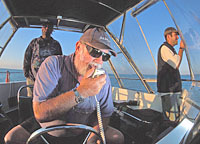 Wally at the helm of 'Moon Dancer' in 2001.