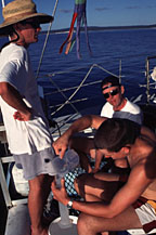 Teacher Peter Langley watches water sampling